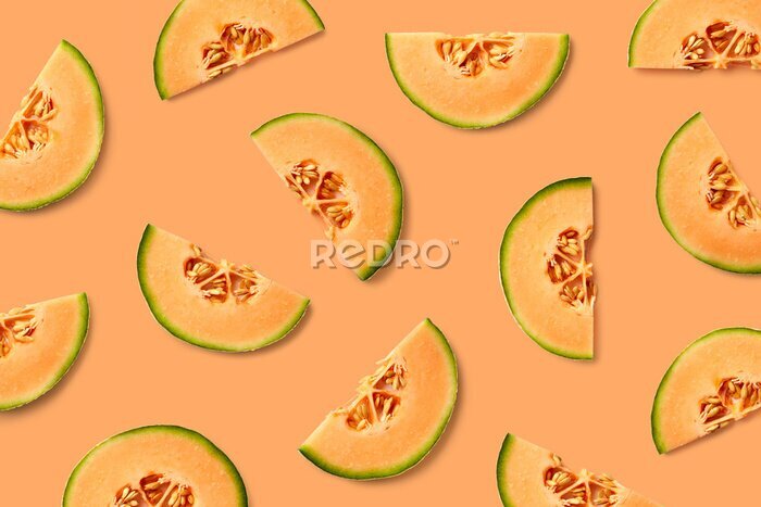 Fotobehang Meloen op een oranje achtergrond
