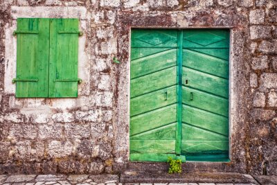 Fotobehang Muur met groene deur