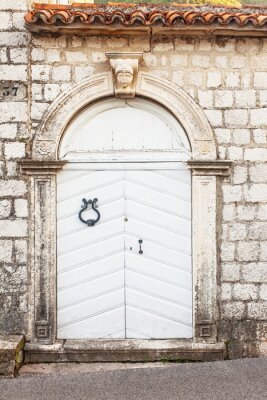Fotobehang Muur met witte deur
