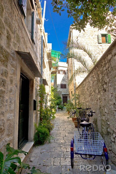 Fotobehang Narrow mediterranean stone street in Stari Grad