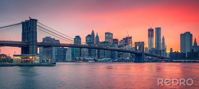 Fotobehang New York badend in zonsondergang