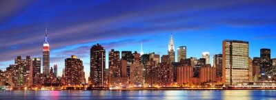 Fotobehang New York bij nachtelijke skyline