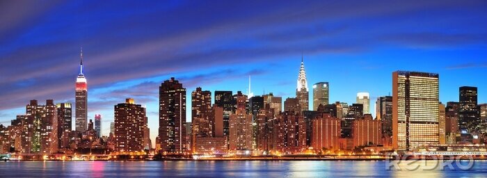 Fotobehang New York bij nachtelijke skyline