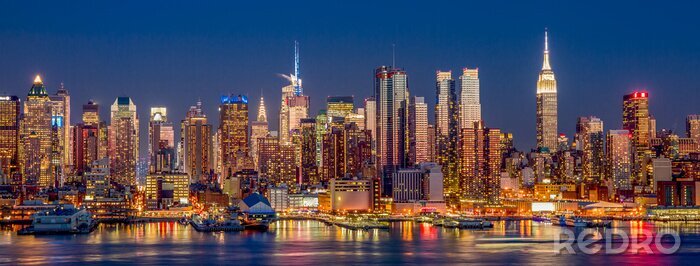 Fotobehang New York City skyline van Manhattan bij nacht