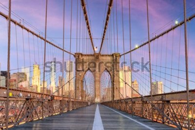 Fotobehang New York, New York on the Brooklyn Bridge Promenade facing Manhattan's skyline at dawn.