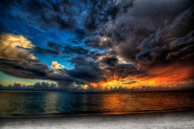 Fotobehang Oceaan met wolken en zonsondergang