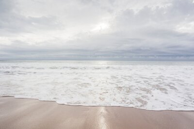 Fotobehang Ocean, sea, sand beach with black clouds on horizon. Zen picture (France-Vendée-Les Sables-d'Olonne)