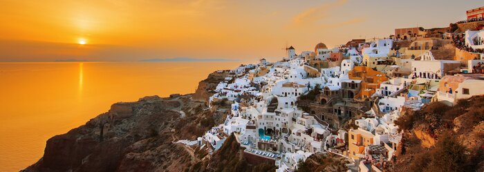 Fotobehang Oia bij zonsondergang, panoramisch uitzicht
