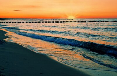 Fotobehang Oranje zonsondergang over de zee