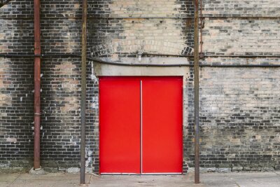 Fotobehang Oud gebouw met rode deuren