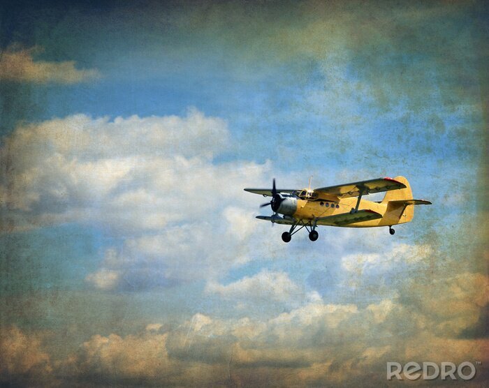 Fotobehang Oud vliegende tweedekker, retro luchtvaart achtergrond