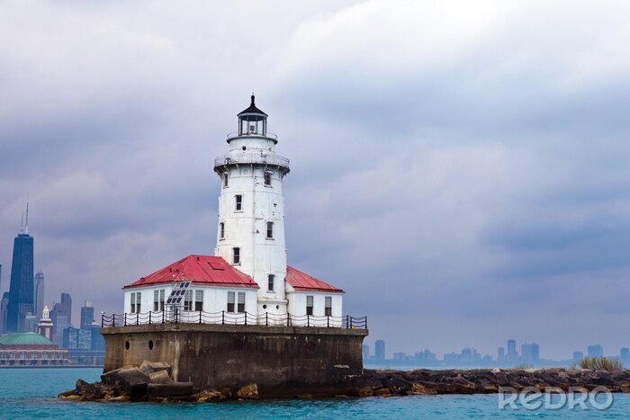 Fotobehang Oude vuurtoren op de golfbreker
