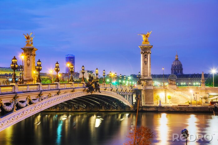 Fotobehang Parijs bij nacht en een brug