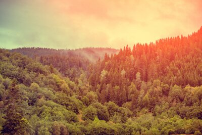 Fotobehang Pastelkleurige zonsondergang in de bergen