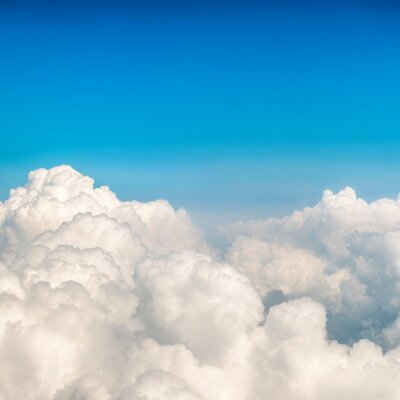 Fotobehang Pluizige wolken en lucht