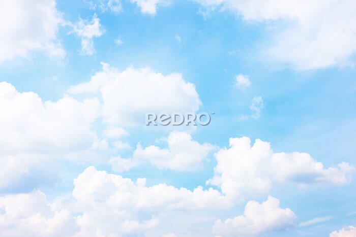 Fotobehang Pluizige wolken in de blauwe lucht