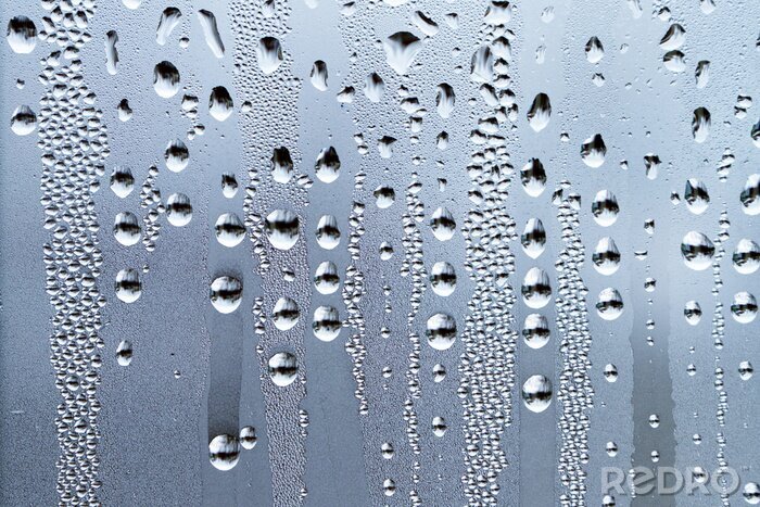 Fotobehang Regendruppels op een glazen oppervlak