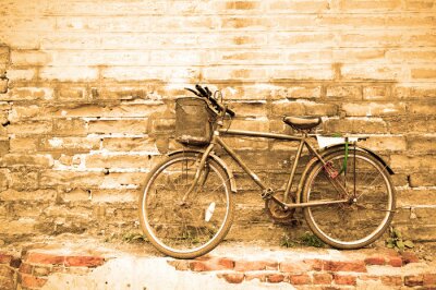 Fotobehang Retro fiets tegen een muur
