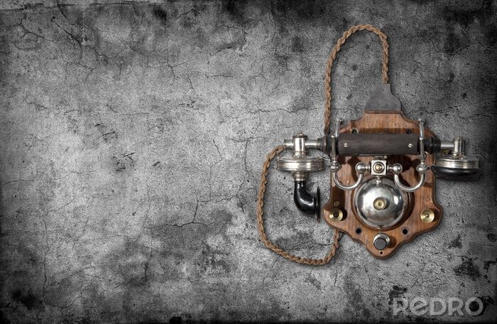 Fotobehang Retro telefoon aan de muur