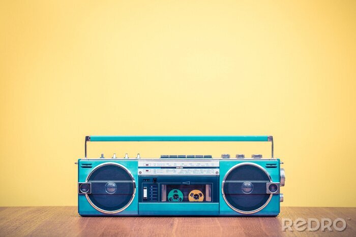 Fotobehang Retro verouderde draagbare stereo mint groene radio cassette recorder van 80s voor geel achtergrond. Vintage oude stijl gefiltreerde foto