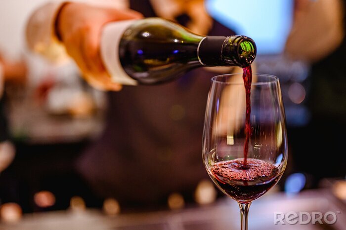Fotobehang Rode wijn en glas