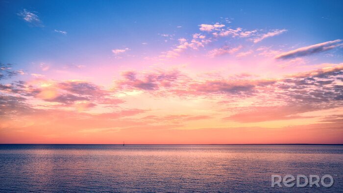 Fotobehang Roze lucht boven de zee