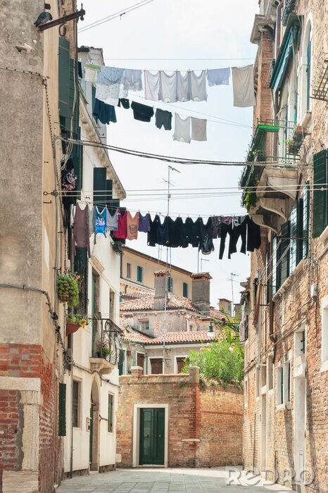 Fotobehang Scenery of hanging clothes in Venice, Italy.