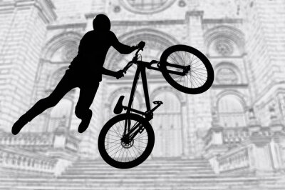 Fotobehang Silhouet van een fietser en fiets voor een gebouw