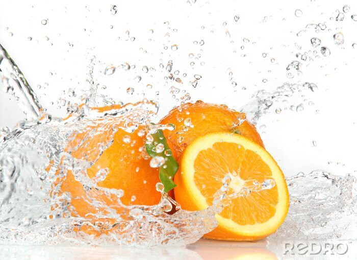 Fotobehang Sinaasappels in water