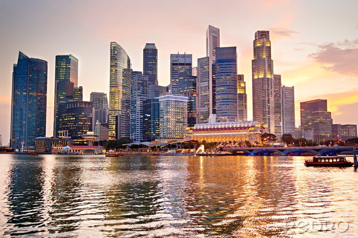 Fotobehang Skyline van de stad Singapore bij zonsondergang