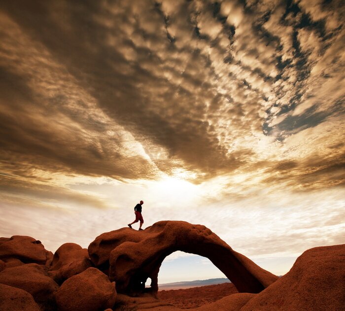 Fotobehang Sportklimmen op een rotsachtige boog