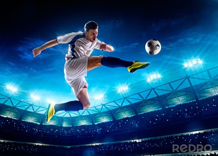 Fotobehang springende voetballer in voetbalstadion