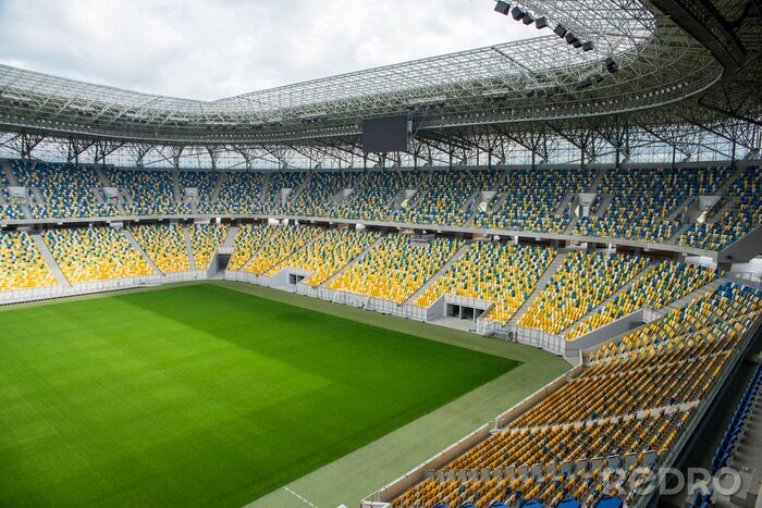 Fotobehang Stadion met gele stoelen