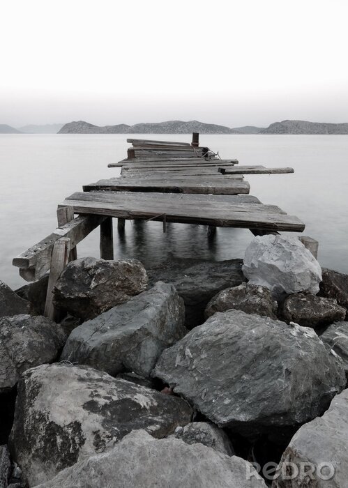 Fotobehang Stenen en oude pier