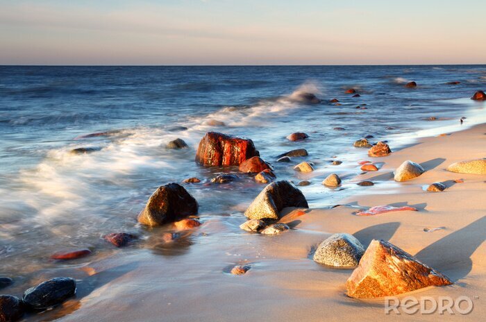 Fotobehang Stenen op de kust