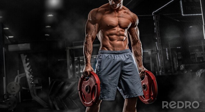 Fotobehang Sterke man met gewichten