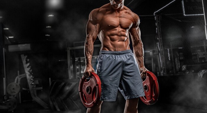 Fotobehang Sterke man met gewichten