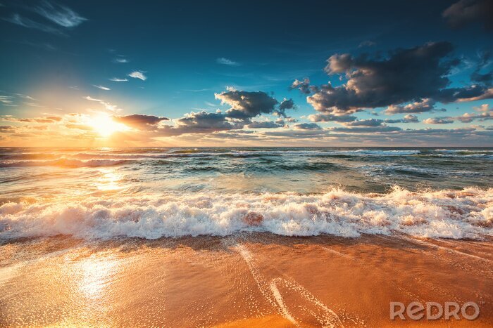 Fotobehang Stralende zonsondergang over de zee