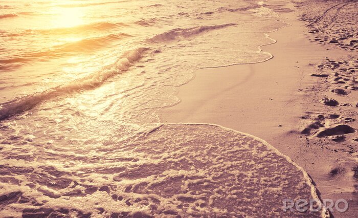 Fotobehang Strand en golven in de zonnestralen