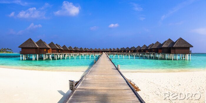 Fotobehang Strand en kleine huisjes aan zee op de Malediven