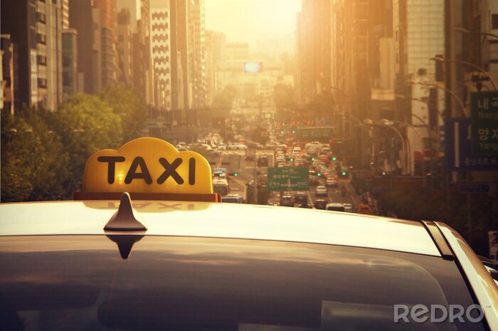 Fotobehang Taxi in het licht van de ondergaande zon