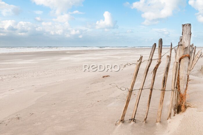 Fotobehang The beach at the Maasvlakte near Rotterdam in the Netherlands on a windy but sunny day
