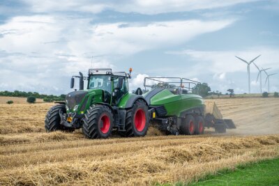 Fotobehang Tractor working in field