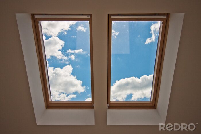 Fotobehang Uitzicht op de heldere lucht vanuit het dakraam