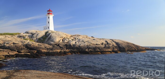 Fotobehang Uitzicht op de vuurtoren vanaf het strand