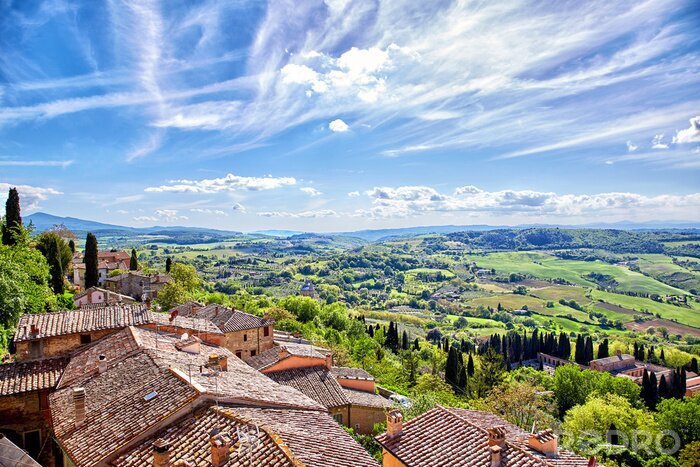 Fotobehang Uitzicht op gebouwen en Toscaanse velden