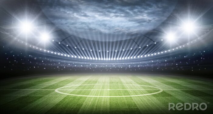 Fotobehang Uitzicht op het veld en het stadion, verlicht door schijnwerpers.