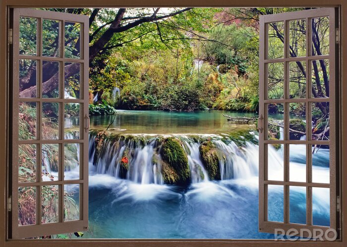 Fotobehang Uitzicht vanuit het houten raam op de waterval