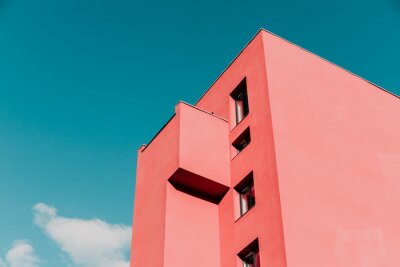 Fotobehang View from below on a pink modern house and sky. Vintage pastel colors, minimalist concept.