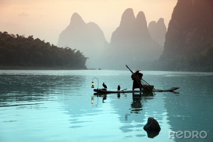 Fotobehang Visser op een boot in Azië